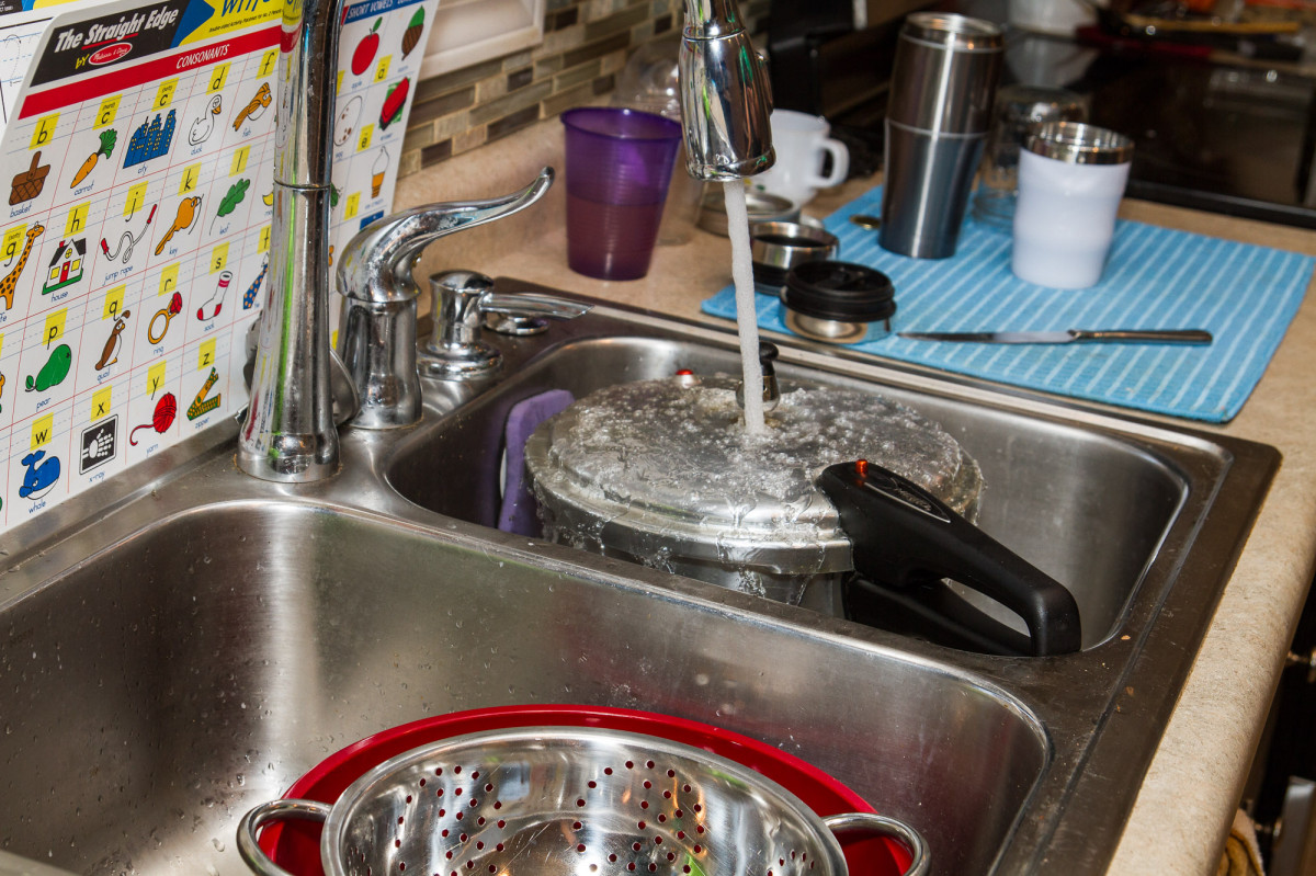 When your time is up, remove the cooker from the stove and place under cold running water. This helps reduce the pressure faster so you can open it.